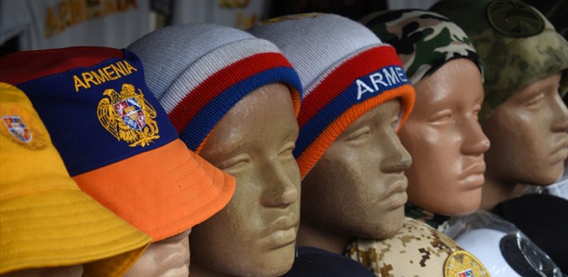 Patriotic caps and woolen hats for sale at an outdoor crafts market in Yerevan, Armenia. (Photo by Larry Luxner)